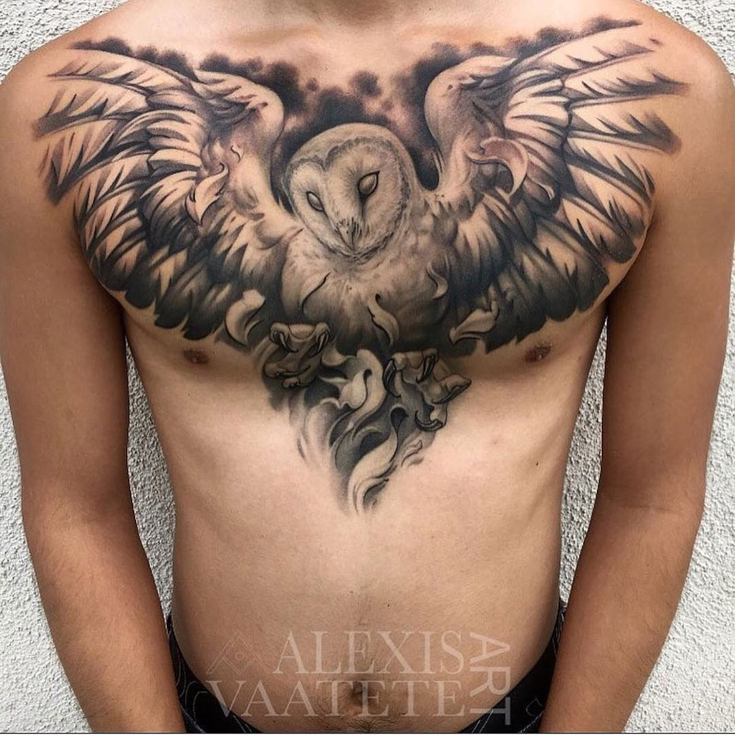 An Owl And Wolf Tattoo On The Chest