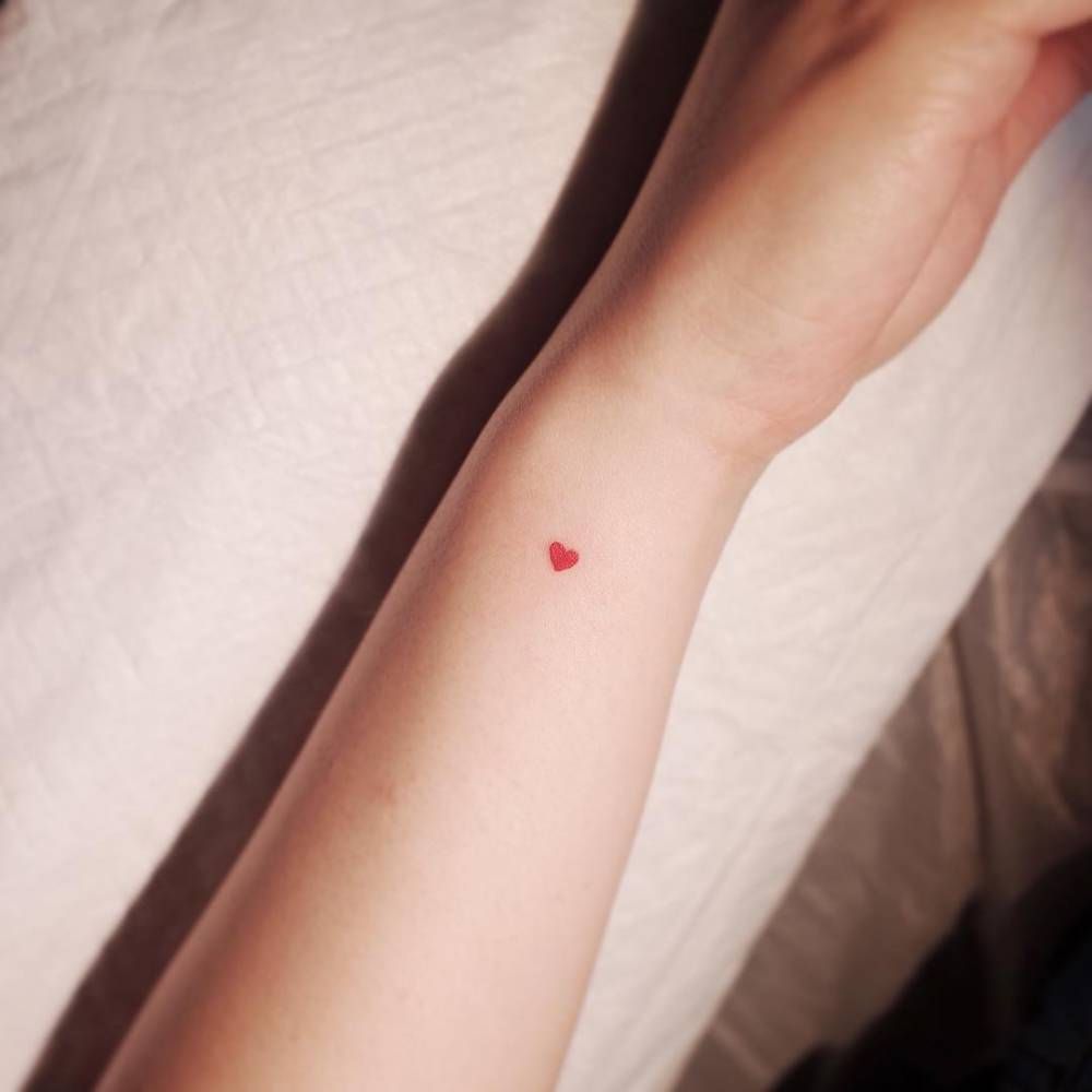 Minimalist Red Heart Tattoo On The Inner Forearm