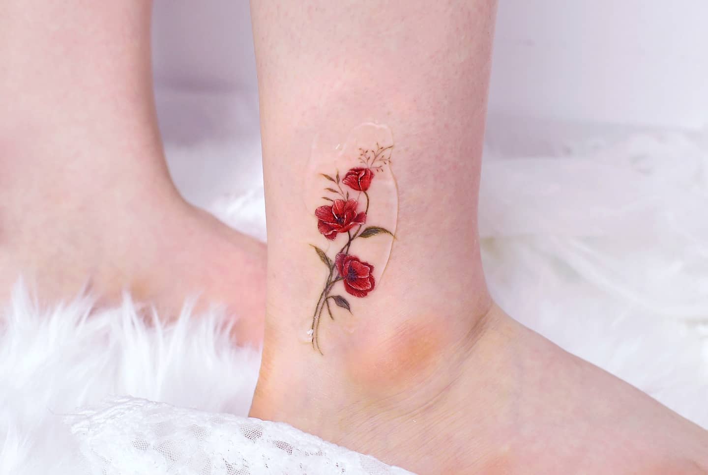 Minimalistic Flower Heart Tattoo Placed On The Ankle